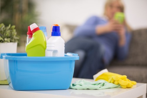 Technician handling cleaning products with protective equipment